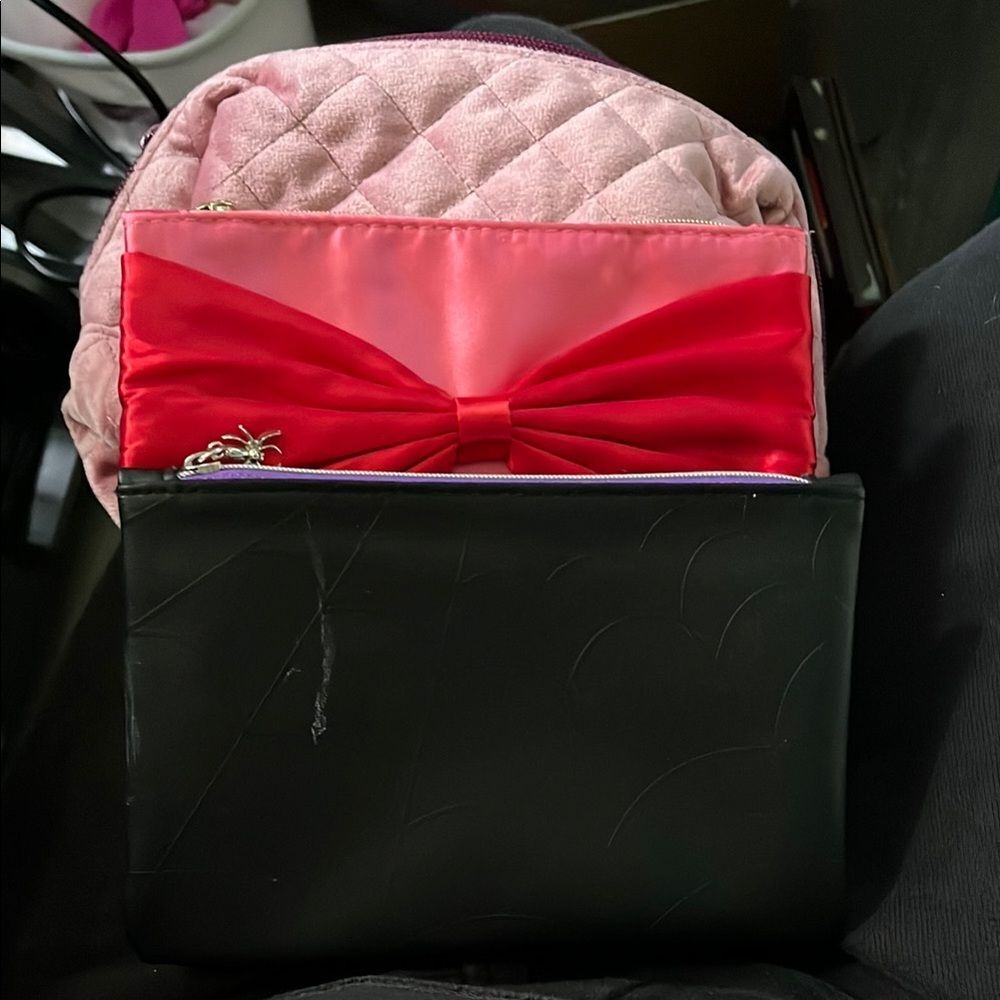 Assorted ipsy makeup and accessory bags